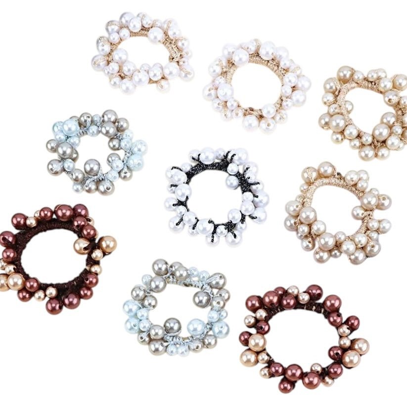 TheCottageEquine.myshopify.com pearl hair ties in various colors including white, blue, brown, and gold on white background